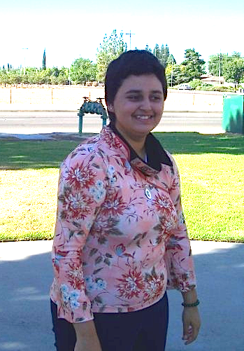 14 year old Danielle Rodriquez with short black hair and a floral pink top